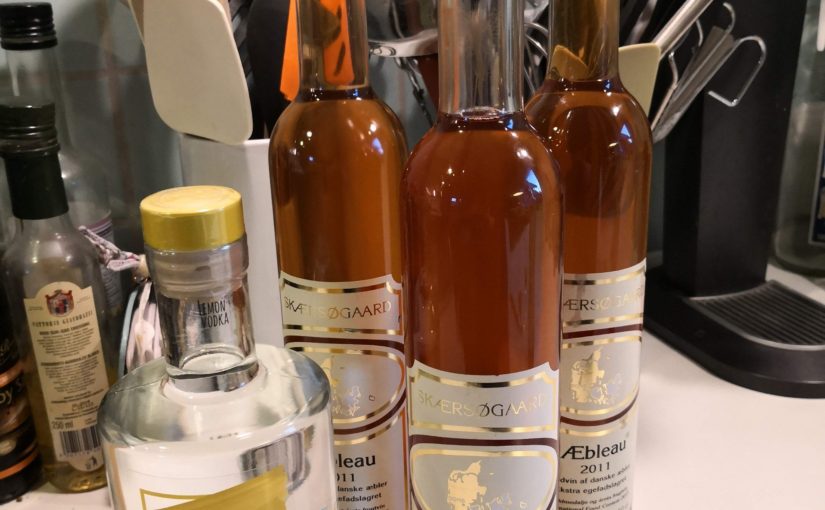 image of 3 bottles of Æbleau, 1 bottle of vodka and kitchen implements